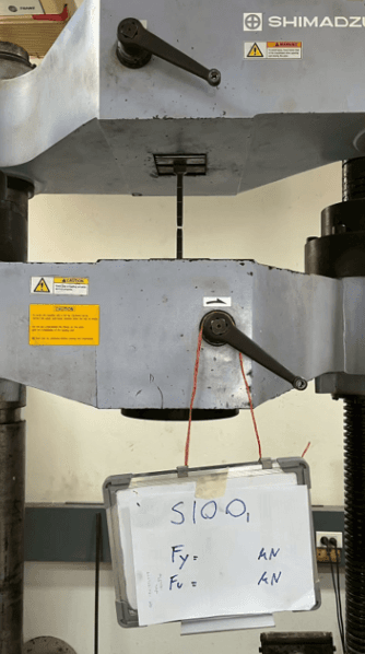 Fig. 3 — Testing with the Universal Testing Machine